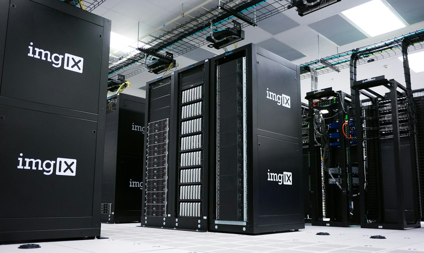 Server farm hardware in a clean white room — production-grade PostgreSQL infrastructure